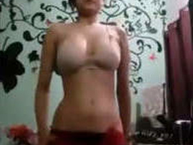 A sexy girl seductively stripping for a man