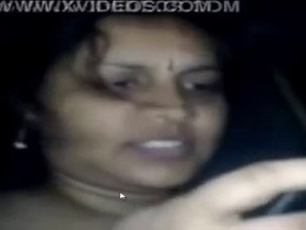 Tamil auntie's video showcases her bouncing breasts while lying down