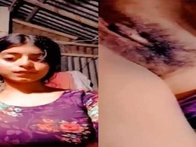 A stunning girl flaunts her tight pussy in a steamy video