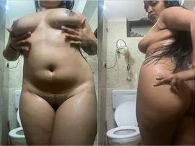 A seductive woman flaunts her naked body and takes a bath