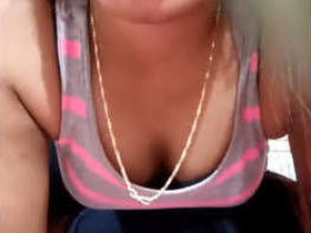 A seductive woman pleasuring herself with her hands