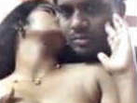 Tamil beauty plays with her natural breasts and kisses in a sensual video