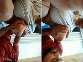 Husband enjoys sucking his wife's big breasts