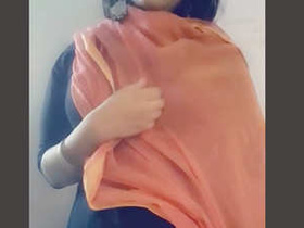Indian girl with big breasts performs in front of the camera