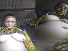 Super-sized boobs and pussy on display in village auntie video