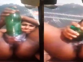 Country girl uses a bottle toy in her vagina