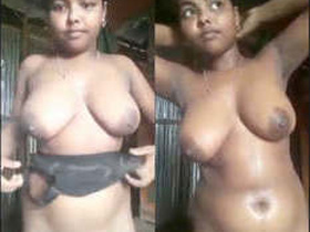 A busty Indian girl pleasures herself by jerking her fingers