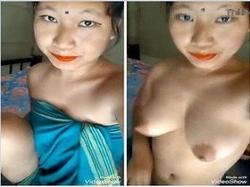 See a stunning girl strip down and reveal her breasts and private parts