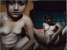 Beautiful Indian woman uses her fingers for pleasure