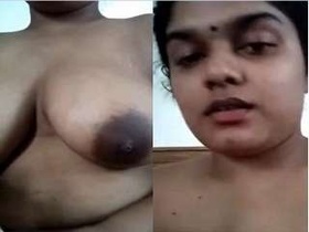 Budi's seductive massage with her ample breasts on display