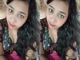 Young woman flaunts her breasts and genitals