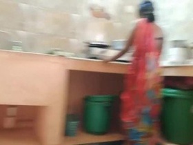 Desi Indian housewife gets caught and fucked by her lover in the kitchen