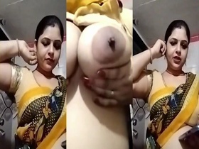 A South Asian mother displays her vagina and buttocks