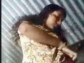 Indian girl flaunts her breasts and vagina in village video