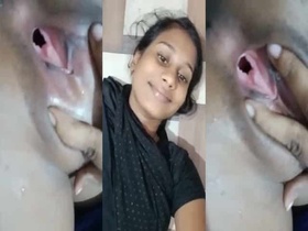 A mischievous woman displays her unclothed genitalia on camera in a bathroom