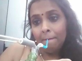 Big boobs babe indulges in solo play with a bong