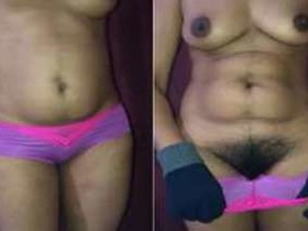 A hot desi girl teases with her gloved hands and lingerie, showing off her naughty body parts