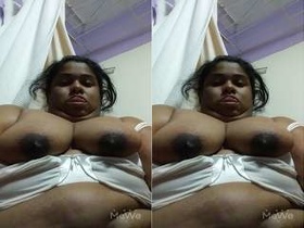 A masturbating NRI bhabhi shows off her big tits on camera