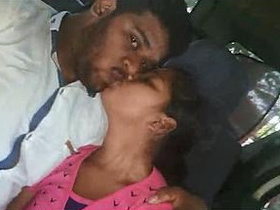 Indian couple shares a passionate kiss while having sex in the back seat of a car