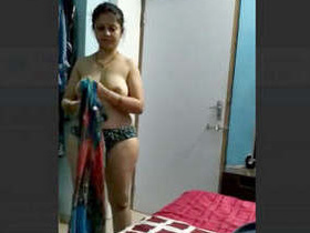Husband records his wife's nude body in a private moment