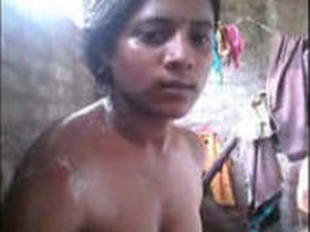 Tamil girl enjoys a bath in soft light