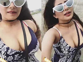 Busty Indian model flaunts her assets on a beach