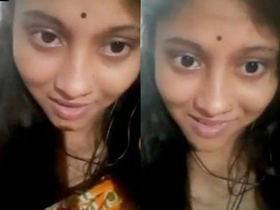 A cute Indian girlfriend flaunts her big breasts in a video call