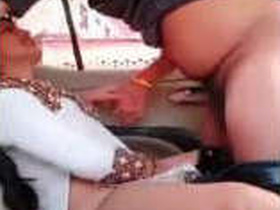 A hot girl pleasures herself in a car