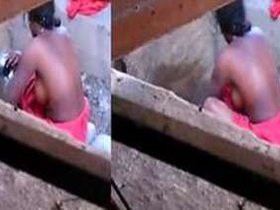 Desi woman washes laundry outdoors and gets caught on camera by a sneaky boy