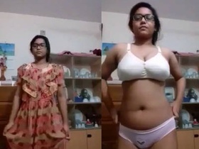 Young and beautiful girl gets naked