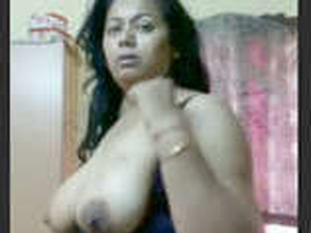 Aunty flaunts her big tits and nice body in a village setting