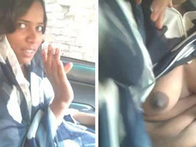 Busty Indian girl shows off her boobs and gives head in a car