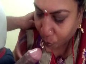 Indian aunty caught on camera giving a blowjob on stairs