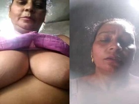 Mature aunty flaunts her ample bosom on camera