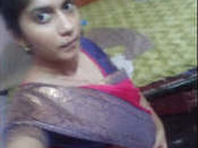 Indian girl flaunts her ample bosom