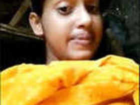 Cute girl bares her breasts and private parts