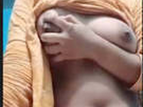 A stunning Indian woman flaunts her breasts
