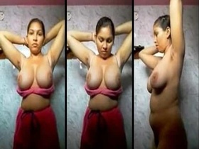 Desi girl with huge natural breasts strips naked in the bathroom