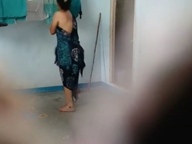 Indian wife in a sari struts outside