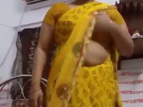 Beautiful Indian bhabhi strips and teases in sari for her lover