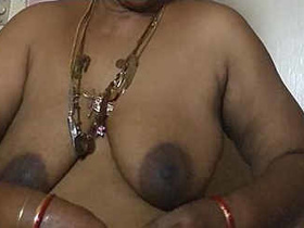 Mature Tamil aunty flaunts her age-defying boobs