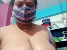 Desi bhabhi massages her big natural breasts with oil