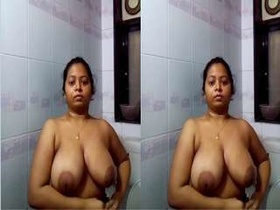 Exclusive video of a horny woman flaunting her big boobs