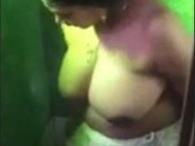 Desi aunty with huge boobs takes a bath and masturbates