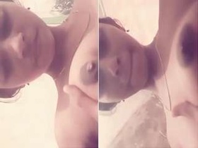 Exclusive video of cute Desi sucking her boobs