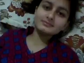 Horny babe in a suit pleasures herself with her hands