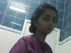 Indian nurse's nude selfies in a bathroom