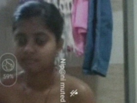 Nude Indian woman enjoys a bath in a solo video