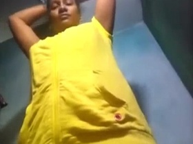 Wife of Cochin is filmed changing into a sari