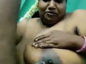 MILF in a tank top sucking cock